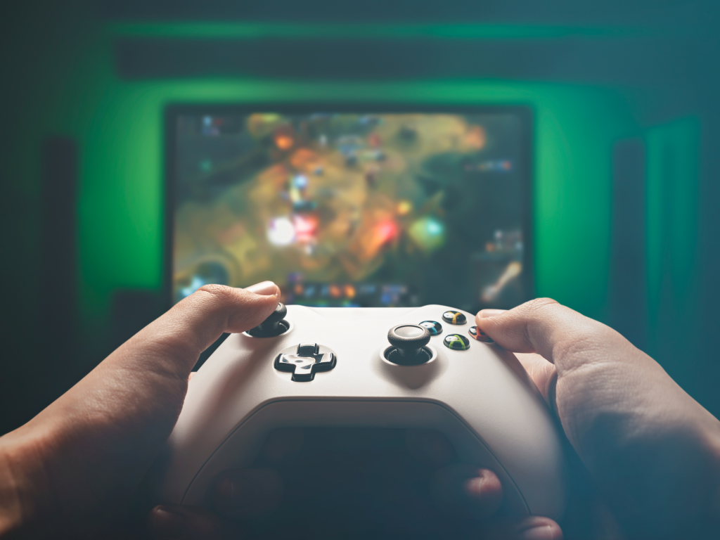 Hands holding a videogame controller. 
