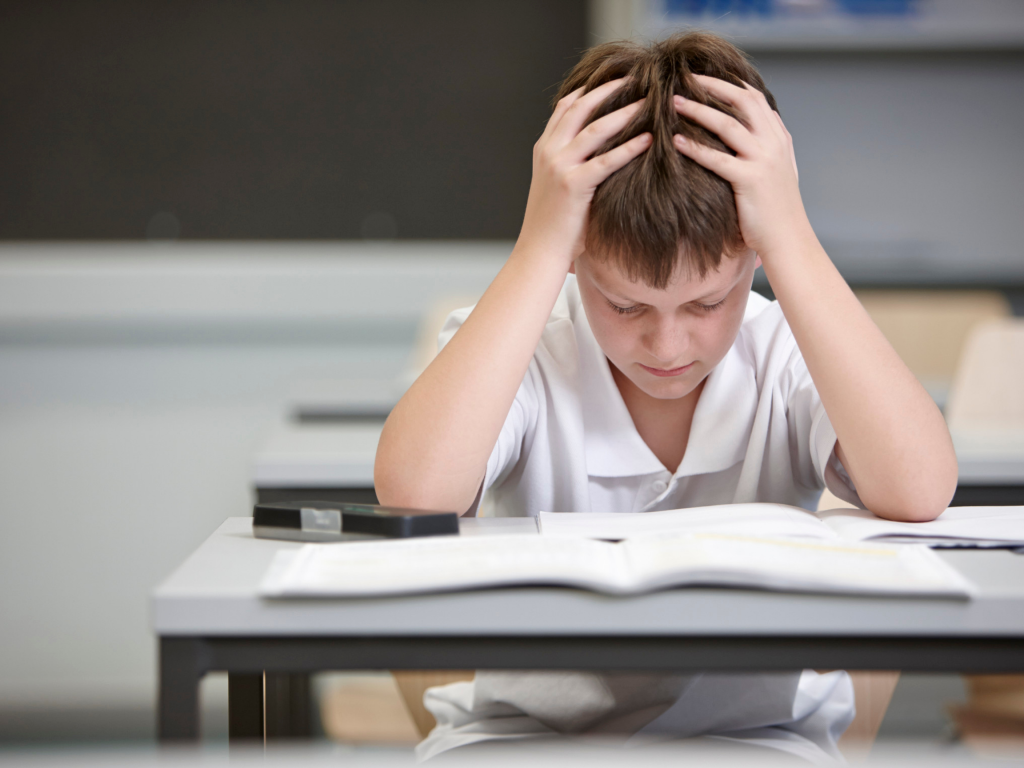 Boy struggling to read.